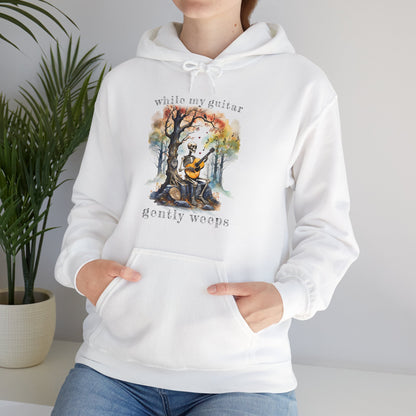 This gothic skeleton hoodies featuring a grisly guitarist jamming on an acoustic guitar in a haunting watercolor forest is a stunning tongue-in-cheek homage to the Beatles music. This stylish lady looks great in this Gildan unisex heavy cotton hooded sweatshirt