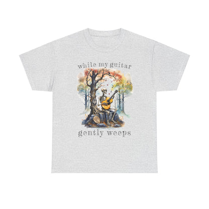 This gothic skeleton T-shirt featuring a grisly guitarist jamming on an acoustic guitar in a haunting watercolor forest is a stunning tongue-in-cheek homage to the Beatles music. This stunning design looks great on this  ash grey Gildan unisex heavy cotton t-shirt.