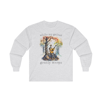 This gothic skeleton long sleeve t-shirt featuring a grisly guitarist jamming on an acoustic guitar in a haunting watercolor forest is a stunning tongue-in-cheek homage to the Beatles music. This haunting design looks great on this white ash grey Gildan unisex heavy cotton long sleeve t-shirt.