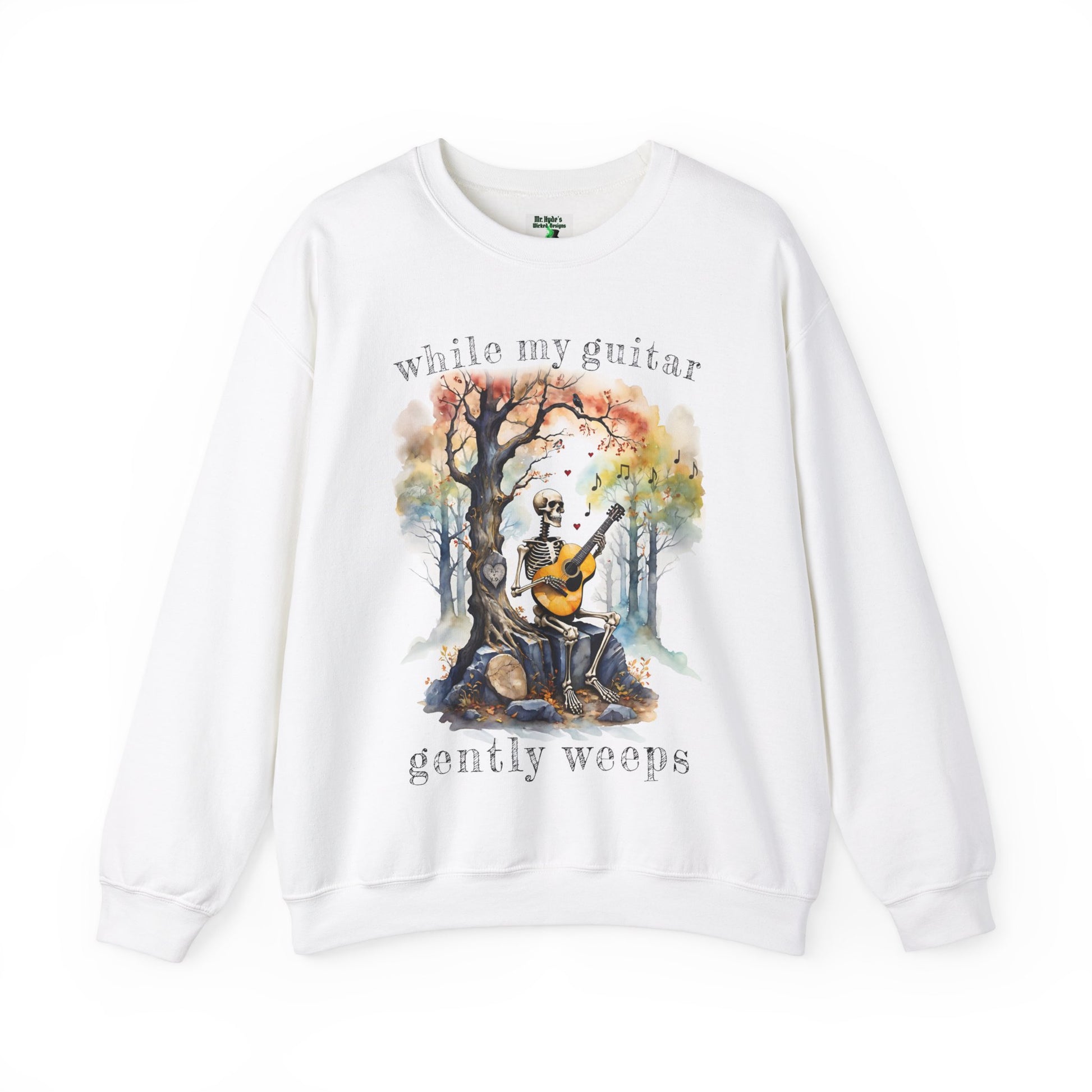 This gothic skeleton sweatshirt featuring a grisly guitarist jamming on an acoustic guitar in a haunting watercolor forest is a stunning tongue-in-cheek homage to the Beatles music. This stylish gothic skeleton design looks great on this Gildan unisex heavy cotton sweatshirt