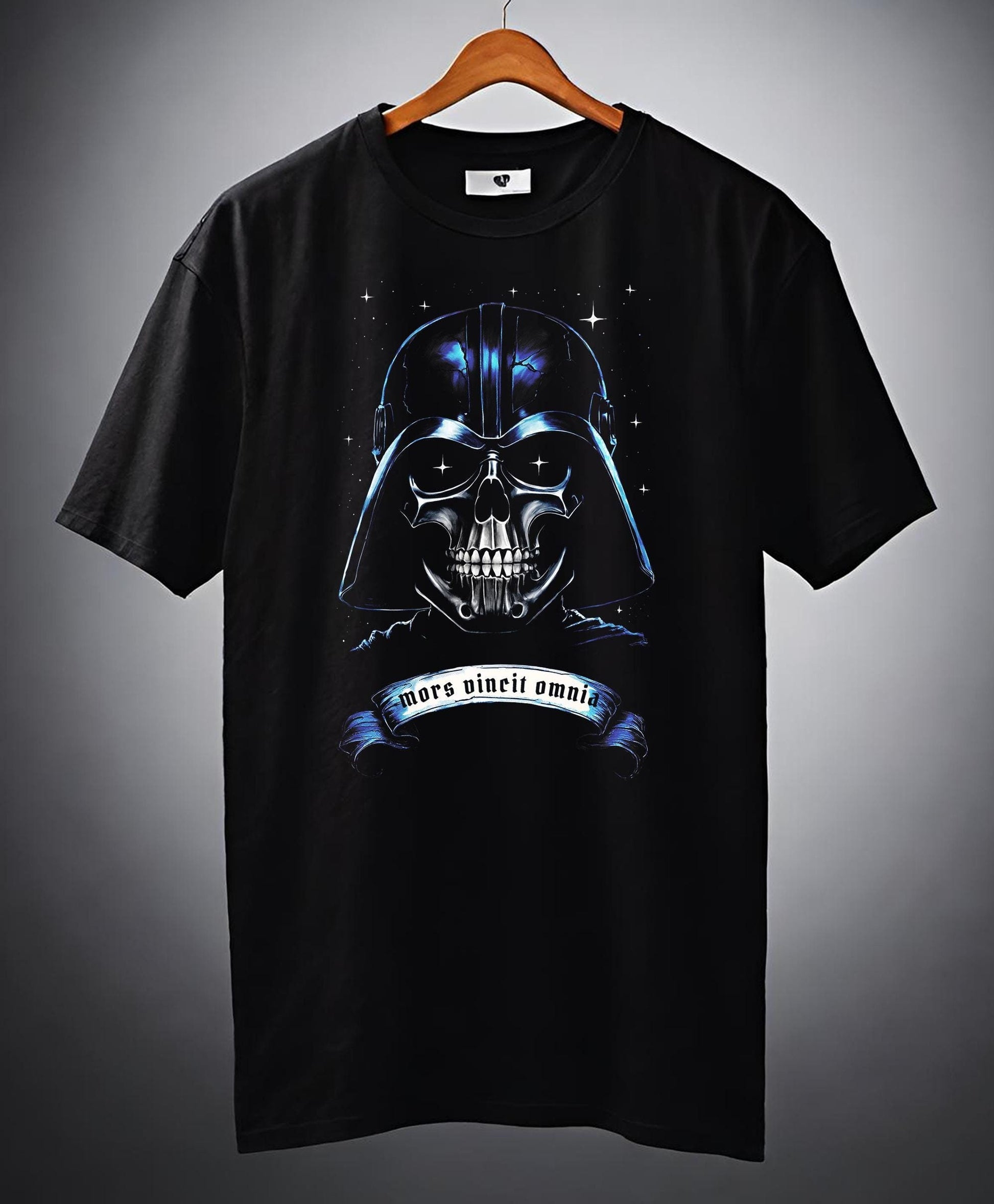 This Star Wars T-shirt is so cool. Vader is captured in a grisly mask of death. This Darth Vader shirt has a skull motif. This design is a halftoned with all the black removed so the design is incredibly light.