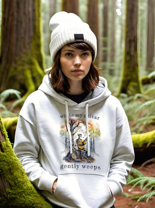 This gothic skeleton hoodies featuring a grisly guitarist jamming on an acoustic guitar in a haunting watercolor forest is a stunning tongue-in-cheek homage to the Beatles music. This stylish lady looks great in this Gildan unisex heavy cotton hooded sweatshirt