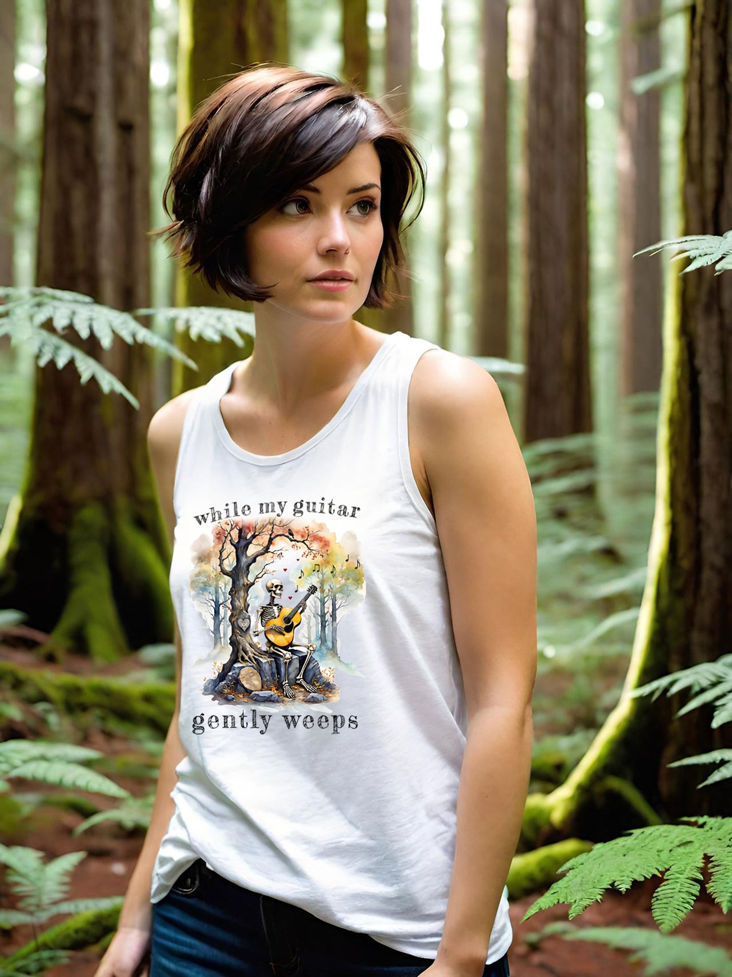 This gothic skeleton Tank Top Tee featuring a grisly guitarist jamming on an acoustic guitar in a haunting watercolor forest is a stunning tongue-in-cheek homage to the Beatles music. This stylish lady looks great in this Gildan unisex jersey tank top tee.